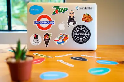 a laptop covered in stickers